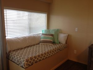 Sitting nook, looks out on view, doubles as a twin bed